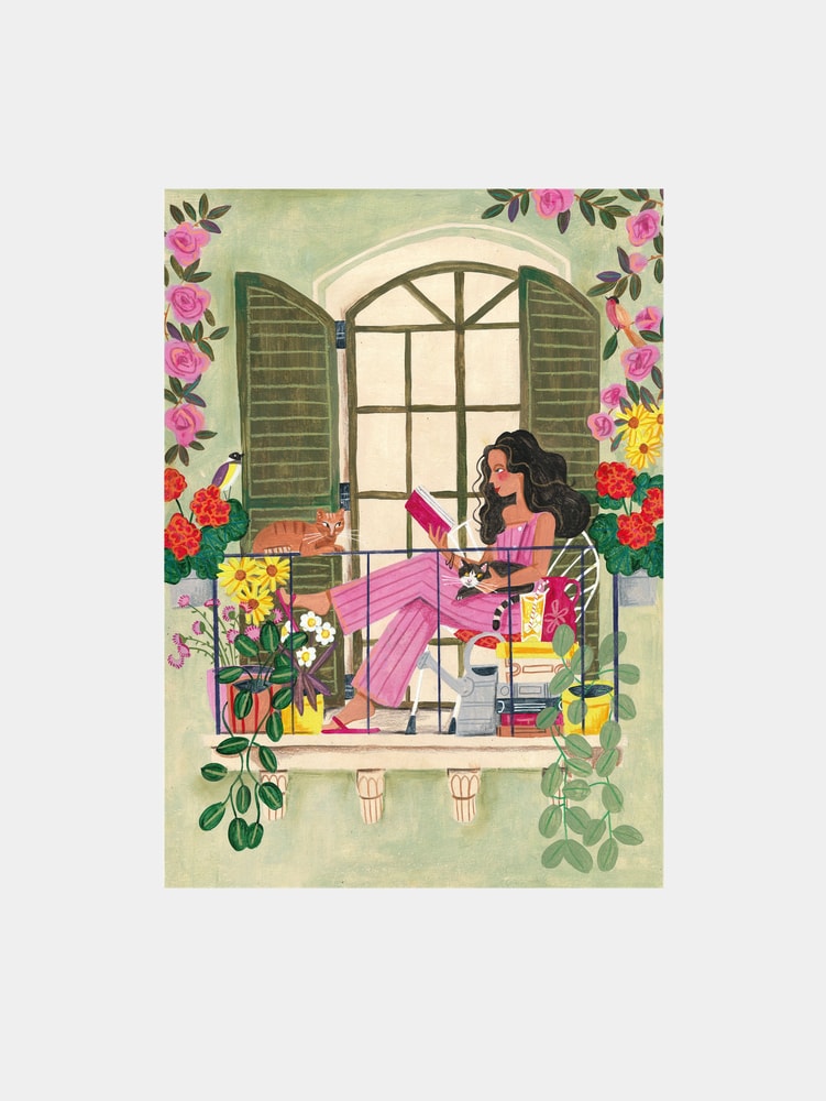 Woman reads on balcony